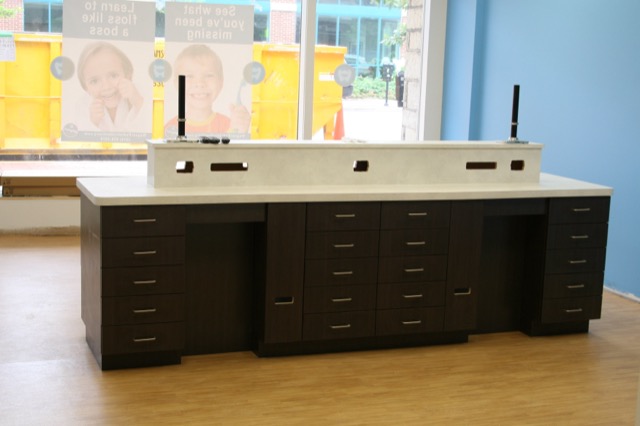 Espresso casework with solid surface top in a dental office
