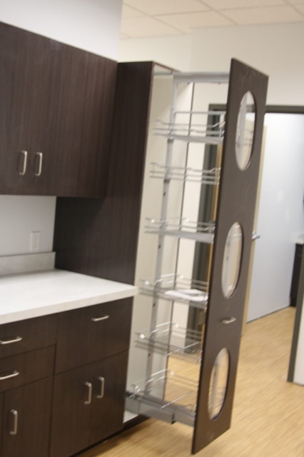 Pull-out pantry hardware in espresso cabinetry