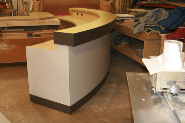 Curved reception desk taking shape in the workshop