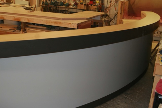 Curved desk front assembled in the workshop