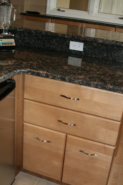 Detail of maple drawers and granite countertop