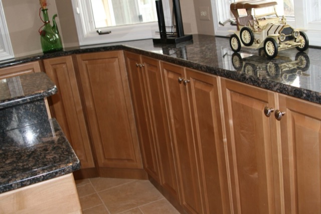 Maple cabinetry run with granite countertop
